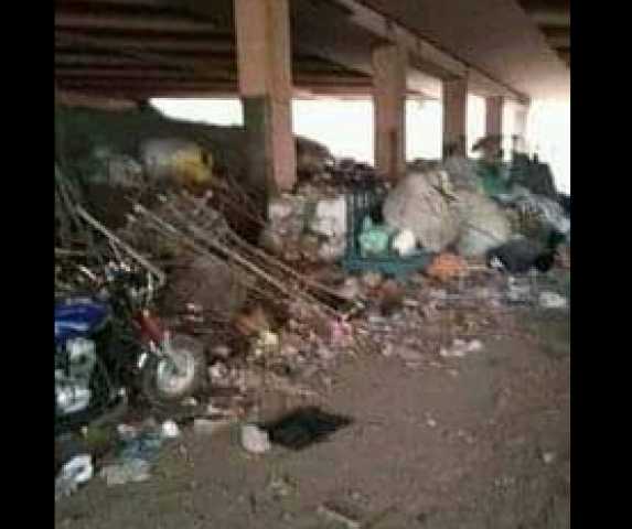 أهالى العمرانية يشكون من انتشار القمامة أسفل نفق الدائرى فى الكونيسة