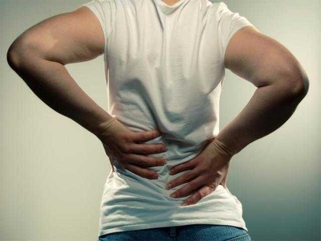 أعراض الانزلاق الغضروفي في الظهر والعلاجات المنزلية