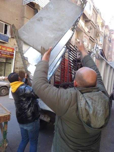 حملات لرفع تعديات المنشآت التجارية والمقاهي في المنيب.. صور